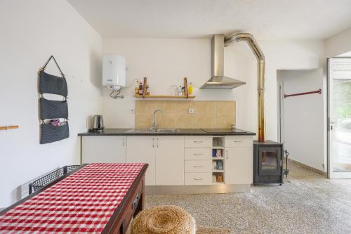 a kitchen with a sink and a stove at Cosy apartment at Portuguese Quinta in Casal Diz
