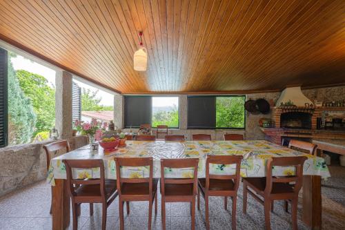 a dining room with a large table and chairs at Cosy apartment at Portuguese Quinta in Casal Diz