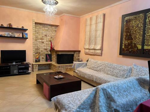A television and/or entertainment centre at Holiday Home in Chalkidiki, Lakkoma