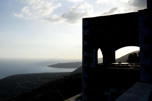 a view of the ocean from a building at Benos Tower in Tsikkaliá