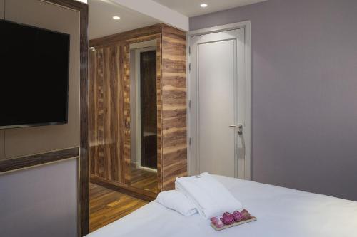 Postel nebo postele na pokoji v ubytování Aira Hotel Bangkok Sukhumvit 11