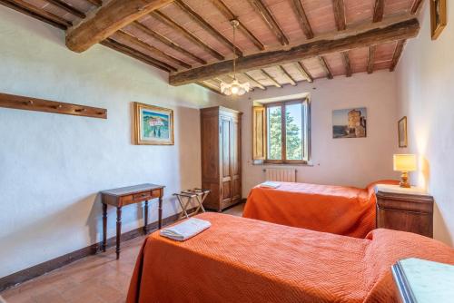 En eller flere senge i et værelse på Brown apartment Siena