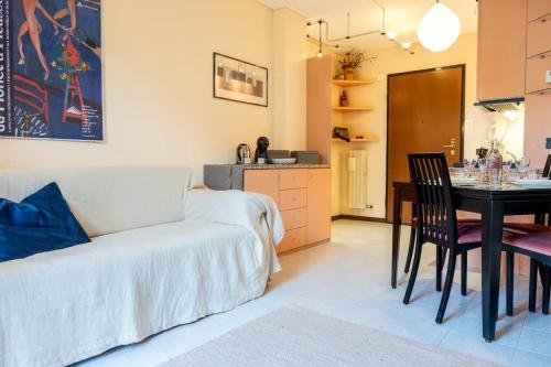 a living room with a bed and a dining room table at Panoramic Chiesa Valmalenco in Chiesa in Valmalenco