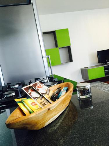 a wooden boat sitting on top of a table at Apartment Heitiare in Papeete