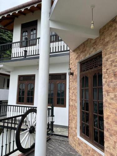 a building with a wheel on the outside of it at Laaya Kandy in Kandy