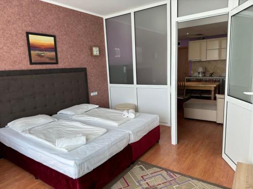 Postel nebo postele na pokoji v ubytování Oasis-Apartament