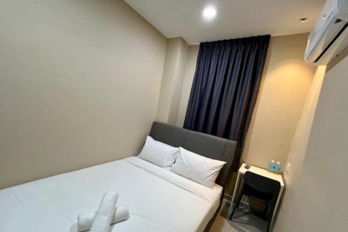 Postel nebo postele na pokoji v ubytování Infinity Hotel Iskandar Puteri