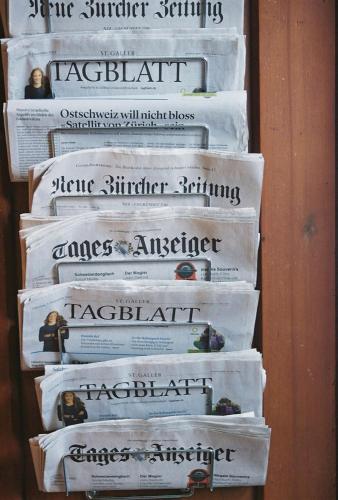 a bunch of books stacked on top of each other at Militärkantine St. Gallen in St. Gallen