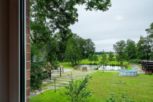 a view of a park from a window at Grodenhof in Norderschwei
