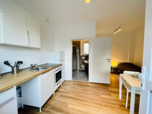 Kuchyň nebo kuchyňský kout v ubytování Moderne Monteurswohnungen in zentraler Lage in Bad Bramstedt