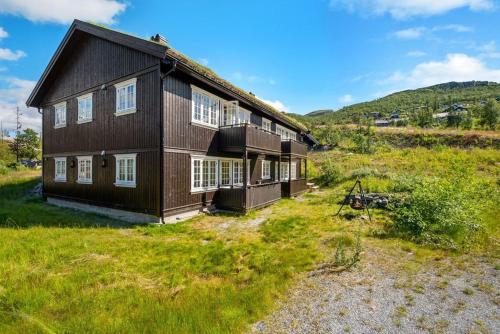 an aerial view of a house in a field at Gaustatoppen View Apartment in Gaustablikk