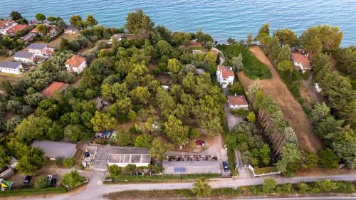 an aerial view of a house on a island in the water at Sylvia Camping & Luxury Suites, Panel Hospitality Homes & Villas in Litochoro