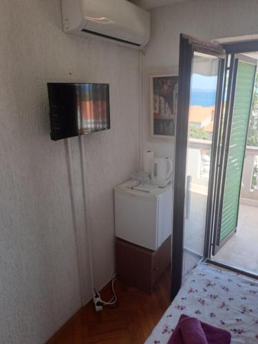 TV a/nebo společenská místnost v ubytování Guest House Romansa