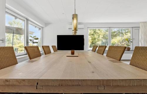 a large dining room with a large wooden table and chairs at Awesome Home In Nordborg With Wifi in Nordborg