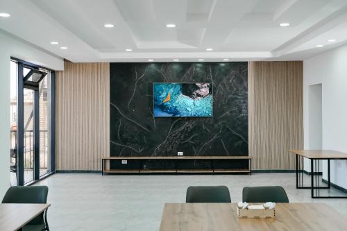 a conference room with a large screen in the ceiling at Hotel Utes in Kaji-Say