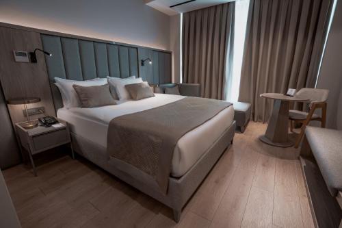 Katil atau katil-katil dalam bilik di RENEX HOTELS