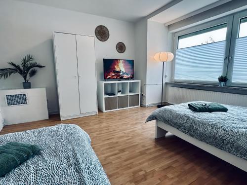 Ένα ή περισσότερα κρεβάτια σε δωμάτιο στο Apartment NeuenHOUSE I Garten & Ruhig
