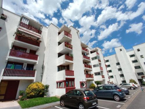 two cars parked in front of a building at Appartement - Hendaye in Hendaye
