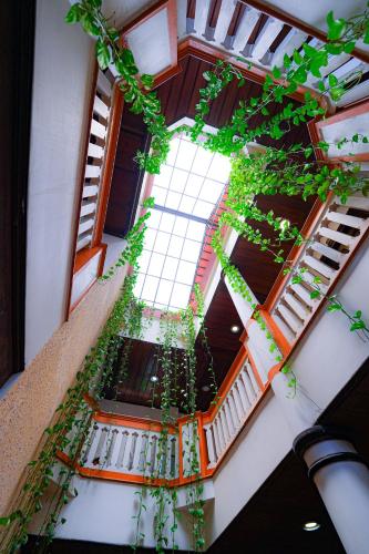 an overhead view of a building with plants at Hotel Arches in Cochin