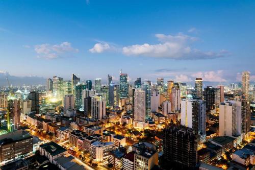 a large city at night with a lot of buildings at F1 Hotel Manila in Manila