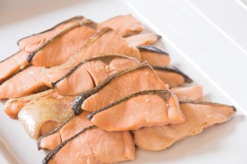 a plate of salmon on a white plate at Diamond Hotel Tokyo in Tokyo