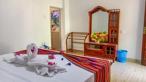 Postel nebo postele na pokoji v ubytování Gimhana Homestay
