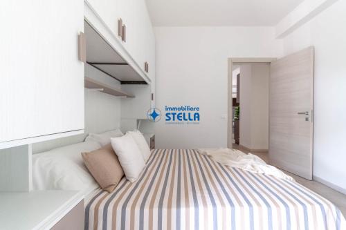 Postel nebo postele na pokoji v ubytování Condominio Trento
