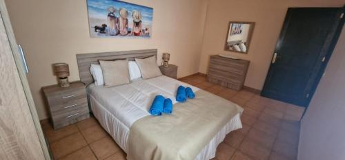 A bed or beds in a room at Apartamento vacacional Fuerteventura 1A