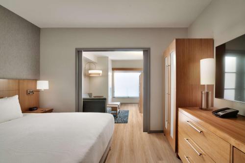 a hotel room with a bed and a desk at Hyatt Place at Anaheim Resort / Convention Center in Anaheim