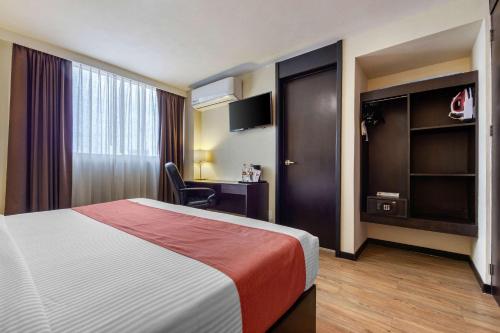 Ένα ή περισσότερα κρεβάτια σε δωμάτιο στο Comfort Inn San Luis Potosi