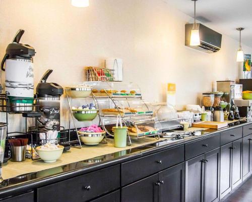 a kitchen with a counter with lots of food at Quality Inn Cairo I-57 in Cairo