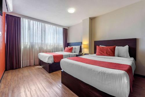 Ένα ή περισσότερα κρεβάτια σε δωμάτιο στο Comfort Inn San Luis Potosi