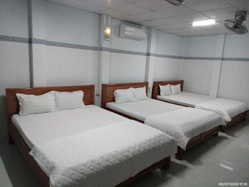 Ένα ή περισσότερα κρεβάτια σε δωμάτιο στο Hai Hien Guesthouse