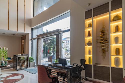 an office with a desk with a computer on it at Regenta Place Amritsar by Royal Orchid Hotels Limited in Amritsar
