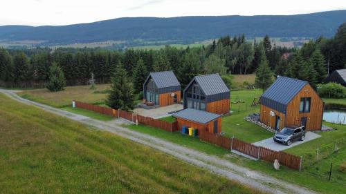 an aerial view of a house in a field at Polana Modraszek in Lasowka