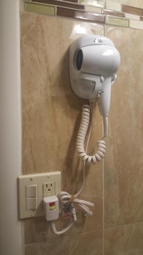 a security camera on a wall in a bathroom at Stay Express Inn Elko in Elko