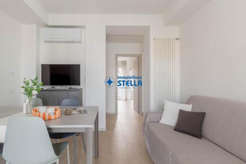TV a/nebo společenská místnost v ubytování Condominio Trento
