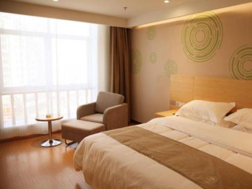 Ένα ή περισσότερα κρεβάτια σε δωμάτιο στο GreenTree Inn Heze Danxian Shangmaocheng Business Branch