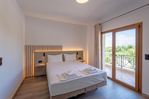 Ένα ή περισσότερα κρεβάτια σε δωμάτιο στο Hotel Agistro