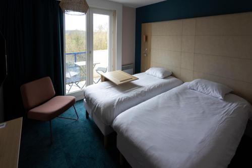 Ένα ή περισσότερα κρεβάτια σε δωμάτιο στο ibis Styles Chinon