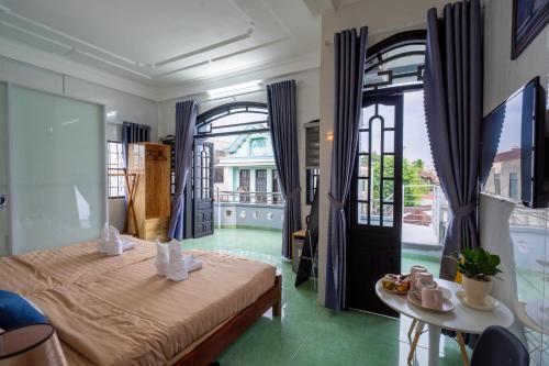 Postel nebo postele na pokoji v ubytování WINPI Homestay