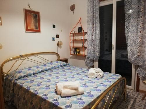 Postel nebo postele na pokoji v ubytování La casa del Capitano, l'uomo e il mare ...