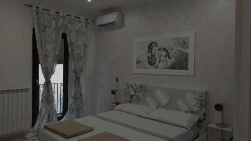 Postel nebo postele na pokoji v ubytování Il Sorriso Casa Vacanze