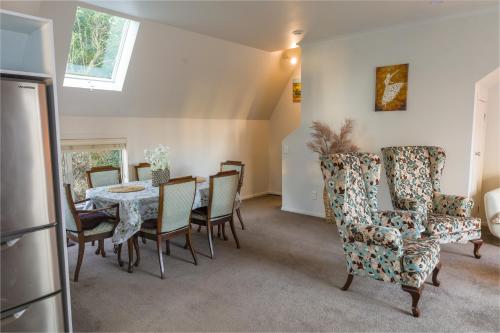 a dining room with a table and chairs at Bolton Executive Residence in Wellington