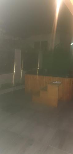 a room with a table and a beam of light at Къща за гости Ози in Ovchartsi