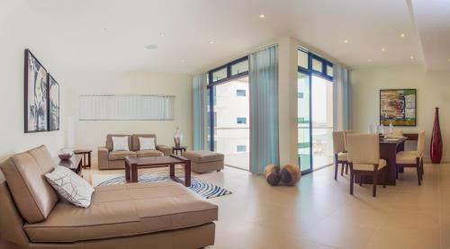 a living room with a couch and a table at Hotel English Point Marina & Spa in Mombasa