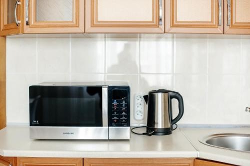 Kuchyň nebo kuchyňský kout v ubytování MiMi Rent & Lev Tolstoi Apartaments