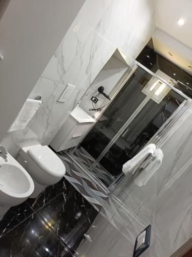 a bathroom with a toilet and a sink at Maison Chic in Ercolano