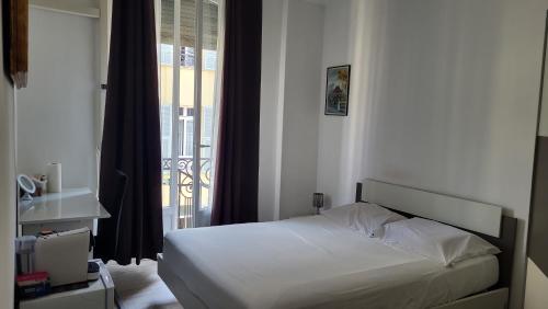 Postel nebo postele na pokoji v ubytování Nizza Bella stay