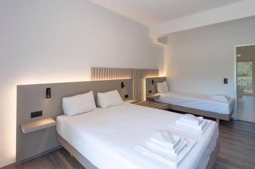 Ένα ή περισσότερα κρεβάτια σε δωμάτιο στο Hotel Agistro